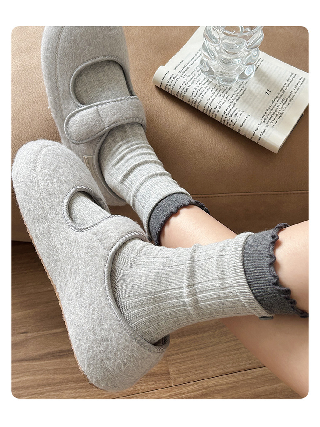 Light gray ribbed socks with dark gray ruffle cuffs styled with gray flats