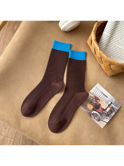 Coffee brown ribbed crew socks with bright blue cuffs