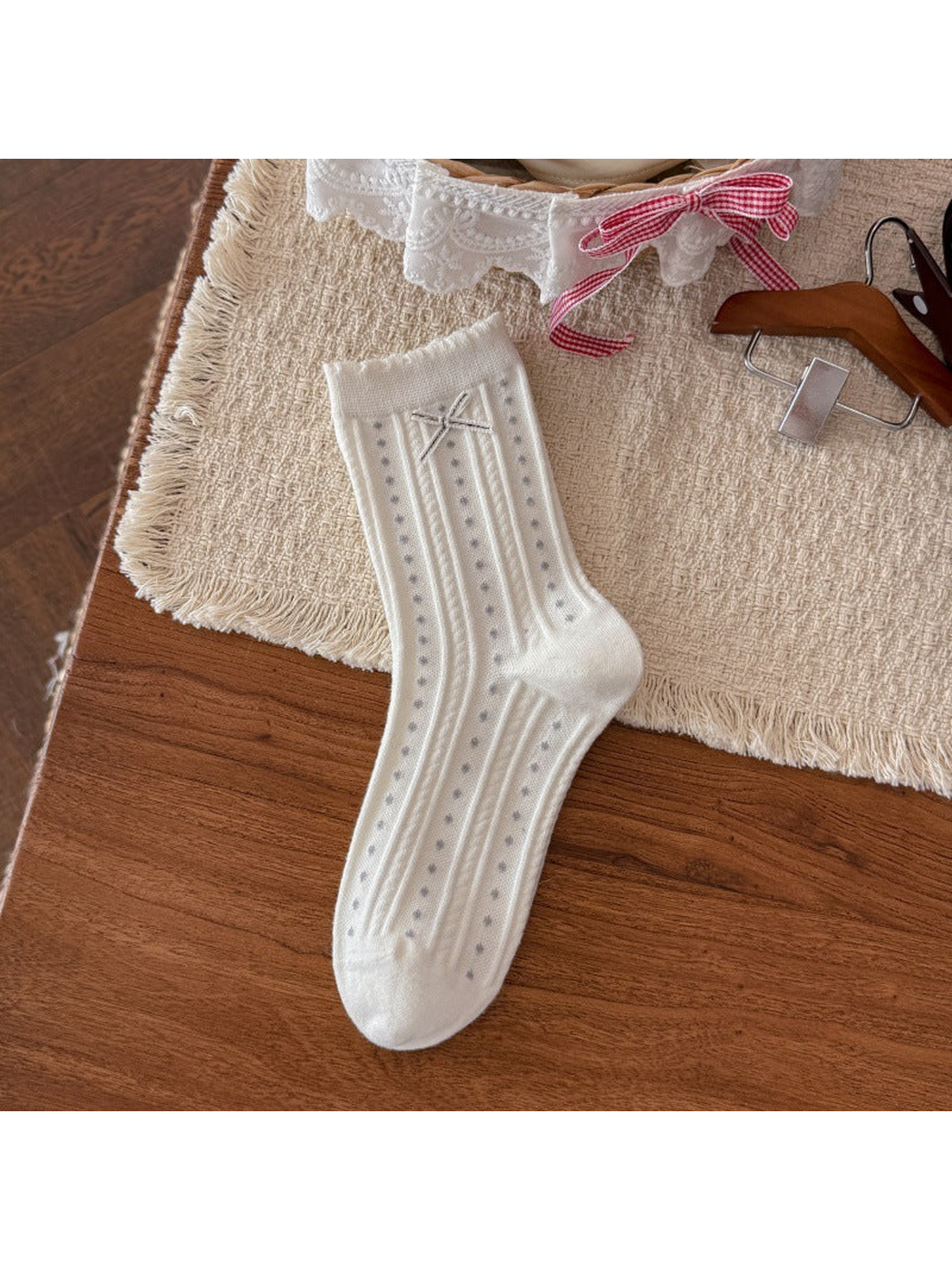 White crew sock with dotted ribbing and ribbon bow