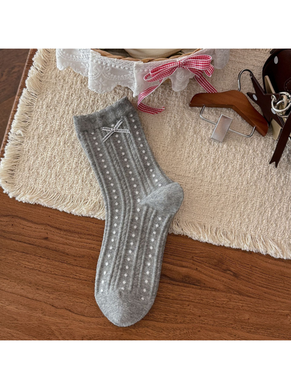 Light gray crew sock with dotted ribbing and ribbon bow