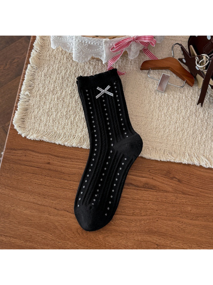 Black crew sock with dotted ribbing and ribbon bow