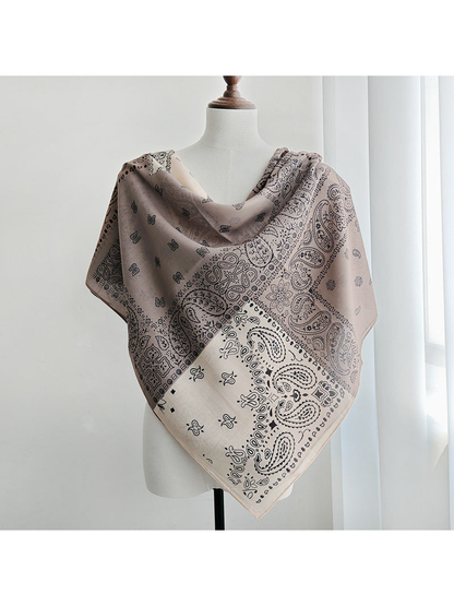 Paisley patchwork square scarf draped across the shoulders with a pointed front