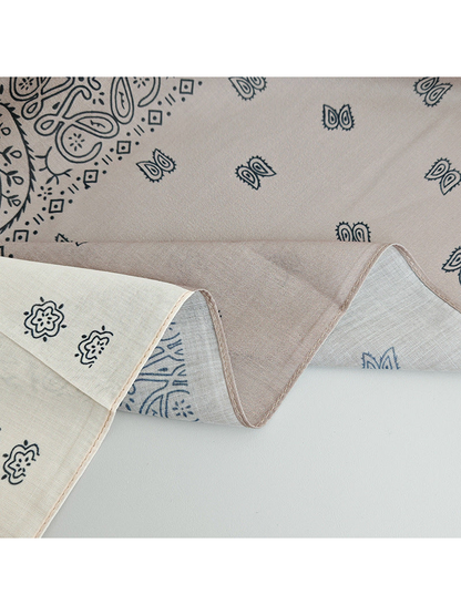 Close-up of the scarf's narrow stitched edge and contrasting printed panels