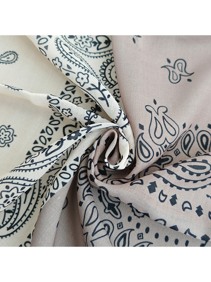 Close-up of the fine woven-look texture and paisley print at gathered folds