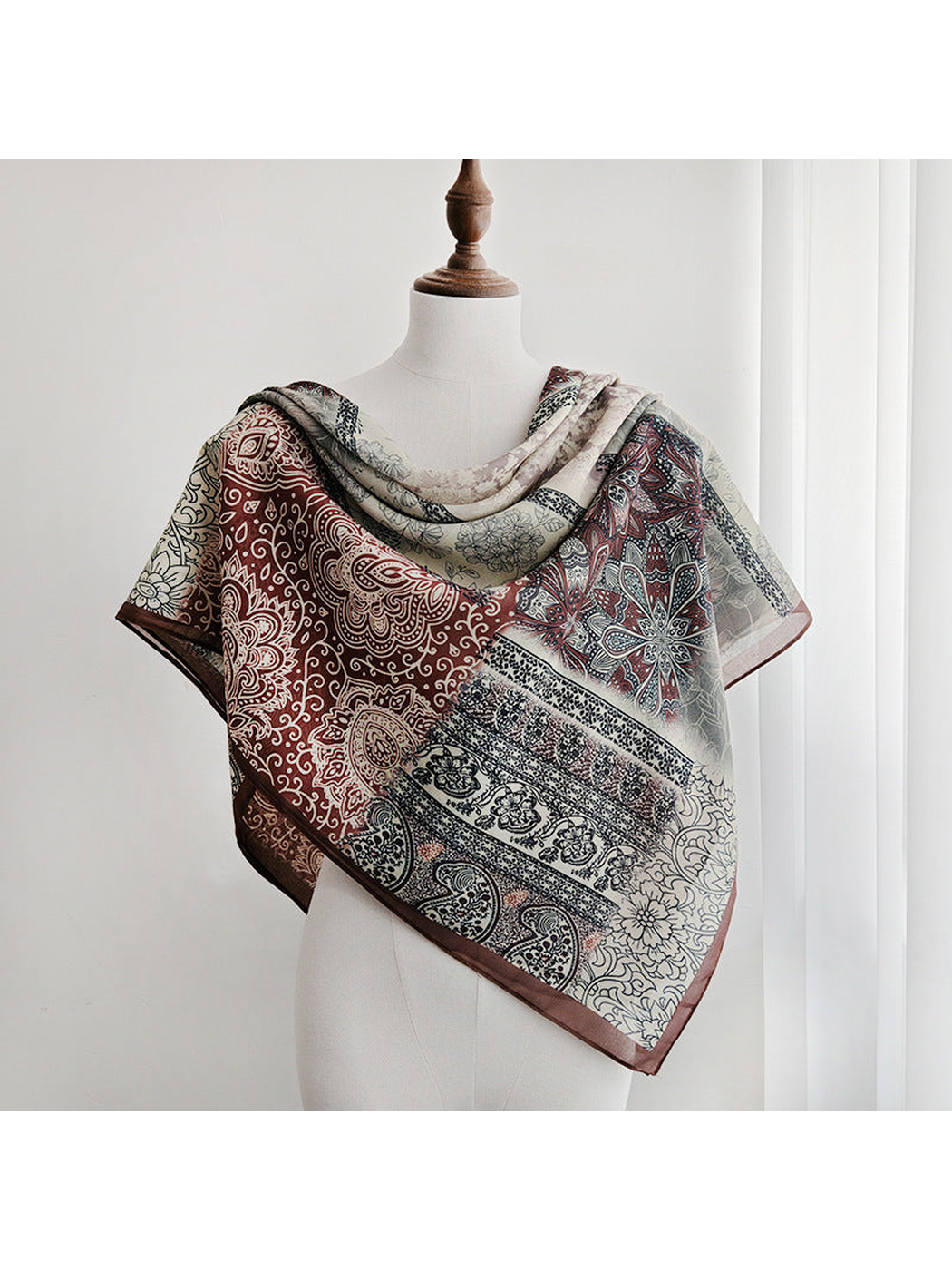 Multicolor patchwork scarf draped around the shoulders