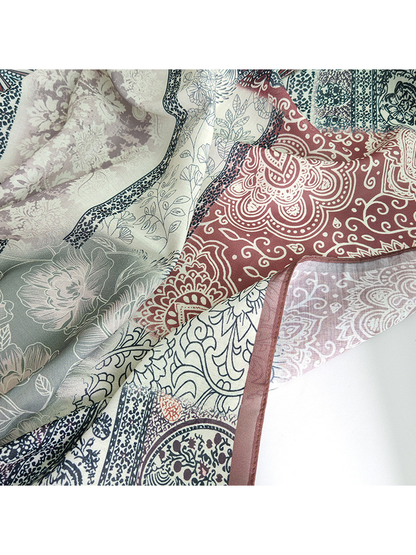 Close-up of the scarf's floral, paisley and ornamental patchwork print