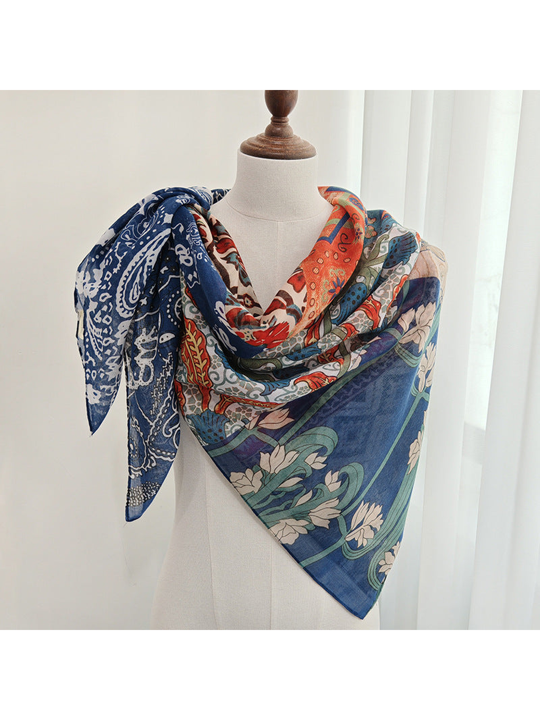 Multicolor patchwork scarf draped around a dress form