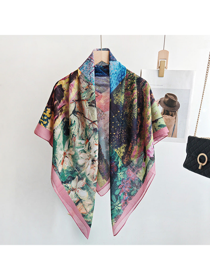 Multicolor square scarf draped over a hanger with a dusty-pink border