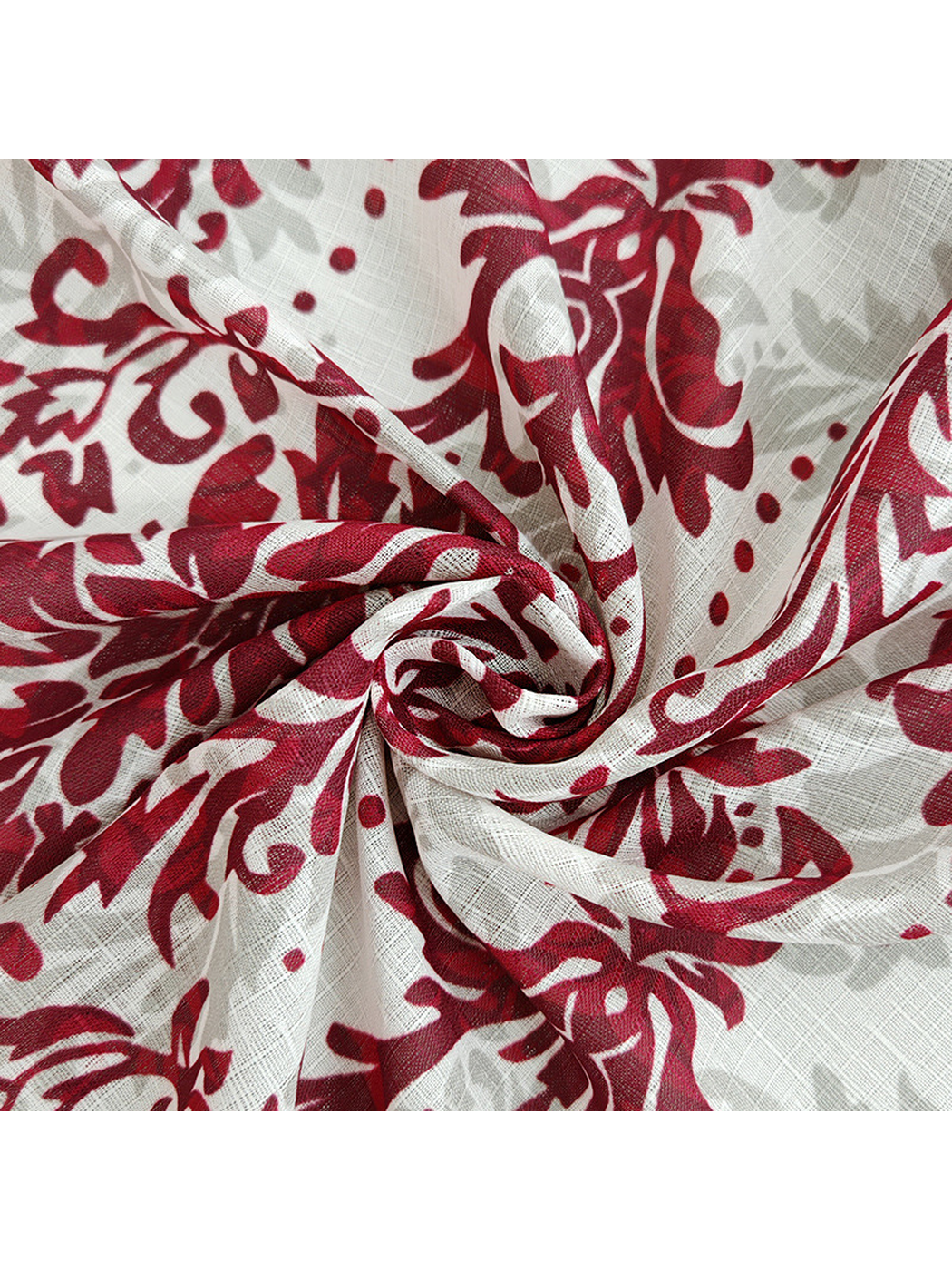 Close-up of the red floral scarf gathered into soft folds
