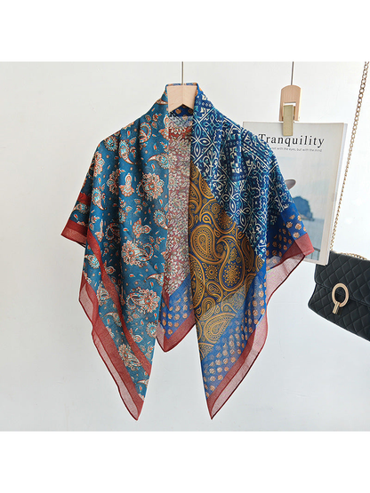 Multicolor patchwork scarf draped from a hanger