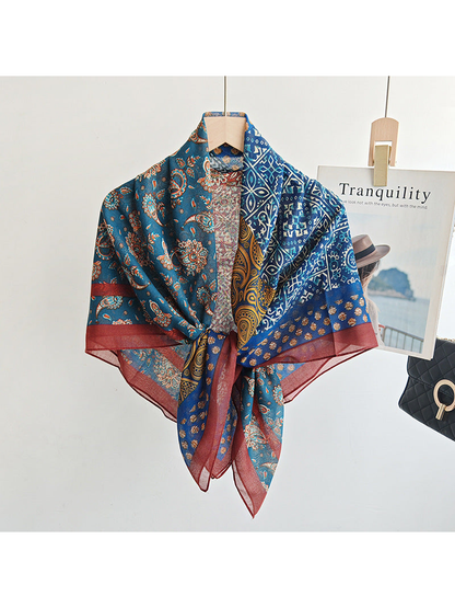 Multicolor patchwork scarf styled in a loose front knot