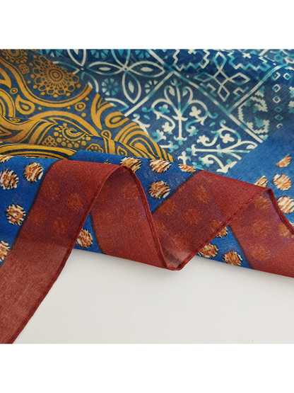 Close-up of the narrow burgundy border and stitched scarf edge