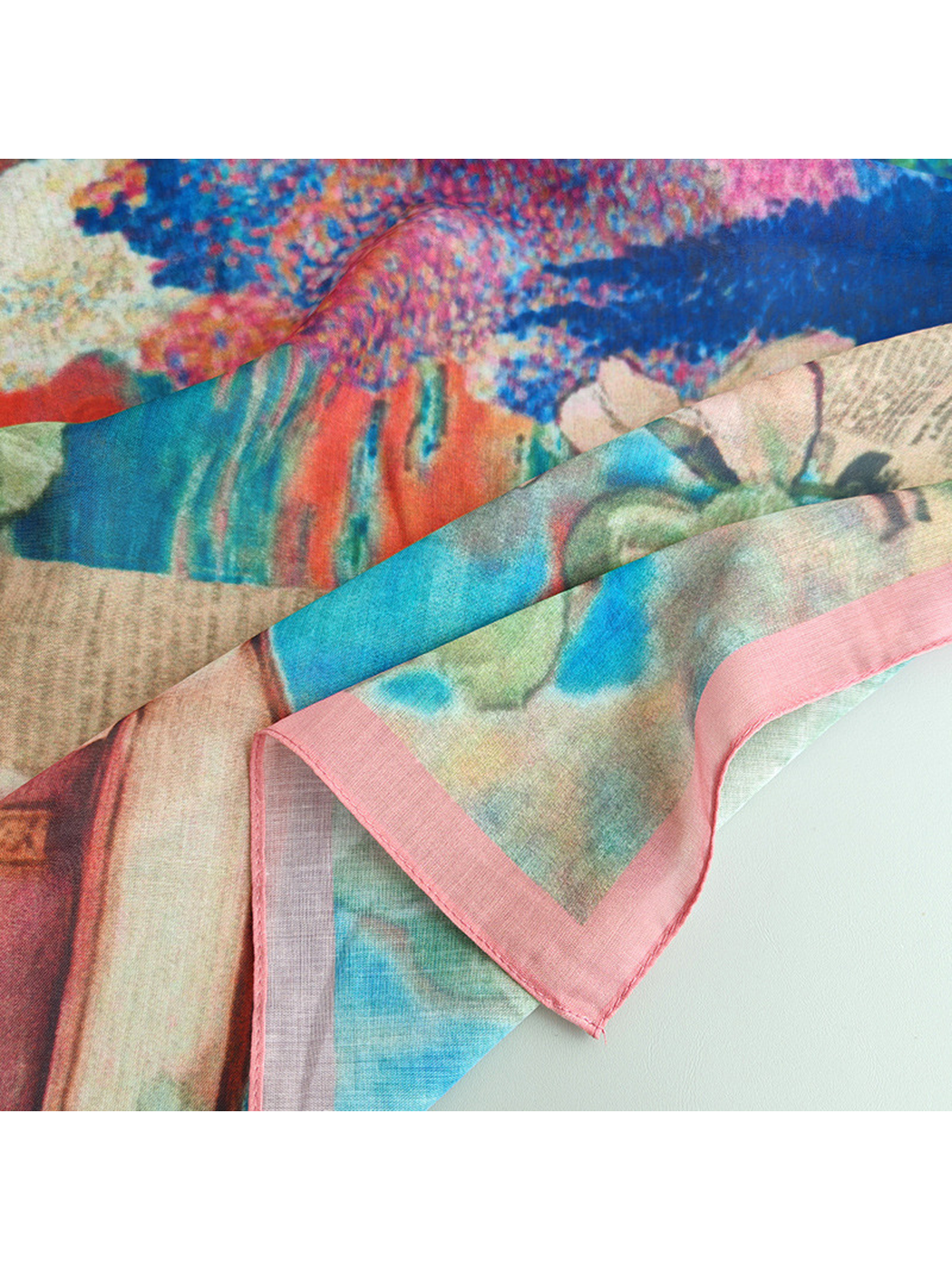Close-up of the colorful scarf print and narrow pink border