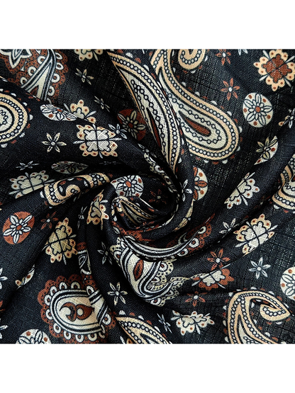 Close-up of the scarf's fine woven-look texture and small paisley print