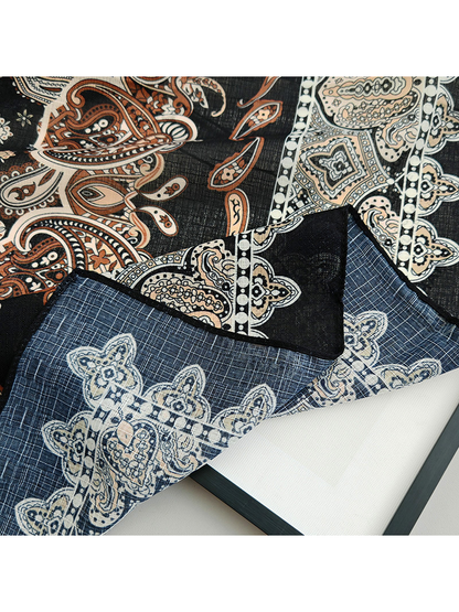 Close-up of the paisley scarf border and blue-gray reverse side