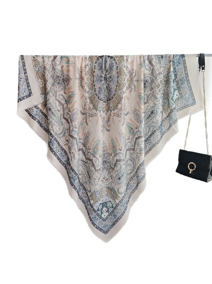 Light blue paisley square scarf with medallion motifs and fringed edges