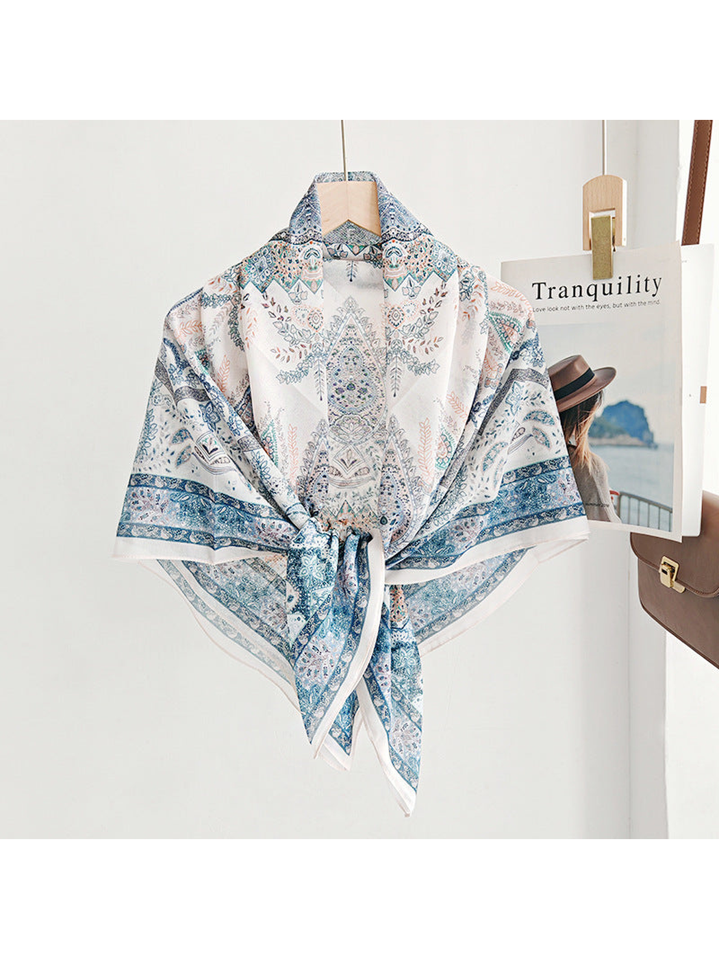 Blue paisley square scarf tied at the front