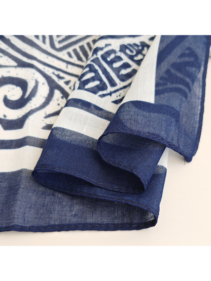 Close-up of the navy striped border and stitched scarf edge