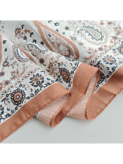 Close-up of the rust stitched border and paisley print