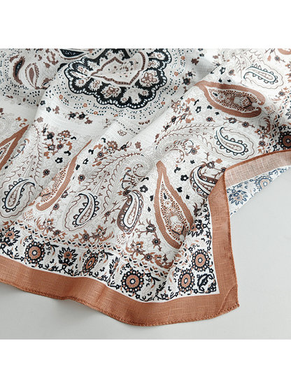 Close-up of the paisley print and rust corner border