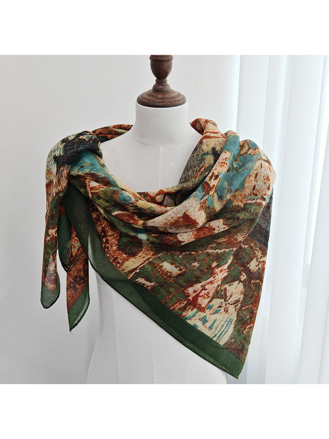 Multicolor square scarf wrapped across a dress form