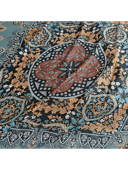 Close-up of the scarf's central floral medallion and surrounding ornament