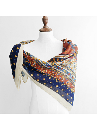 Multicolor ornamental scarf draped diagonally across a mannequin's shoulders