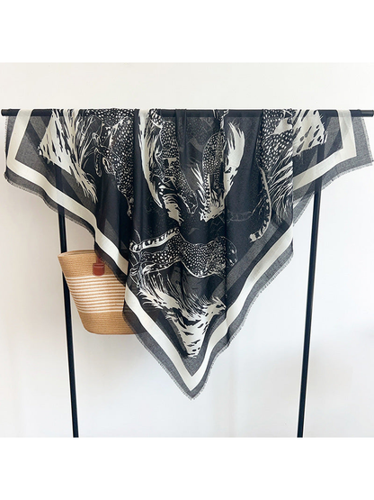 Black square scarf with ivory big-cat print and contrasting border