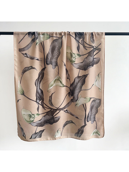 Beige scarf with charcoal leaves and pale green flowers