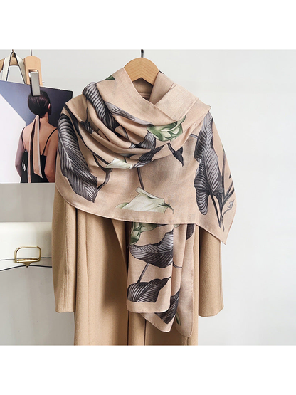 Beige floral scarf styled over a neutral coat