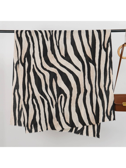 Black and ivory zebra-stripe scarf displayed open with short fringed edges