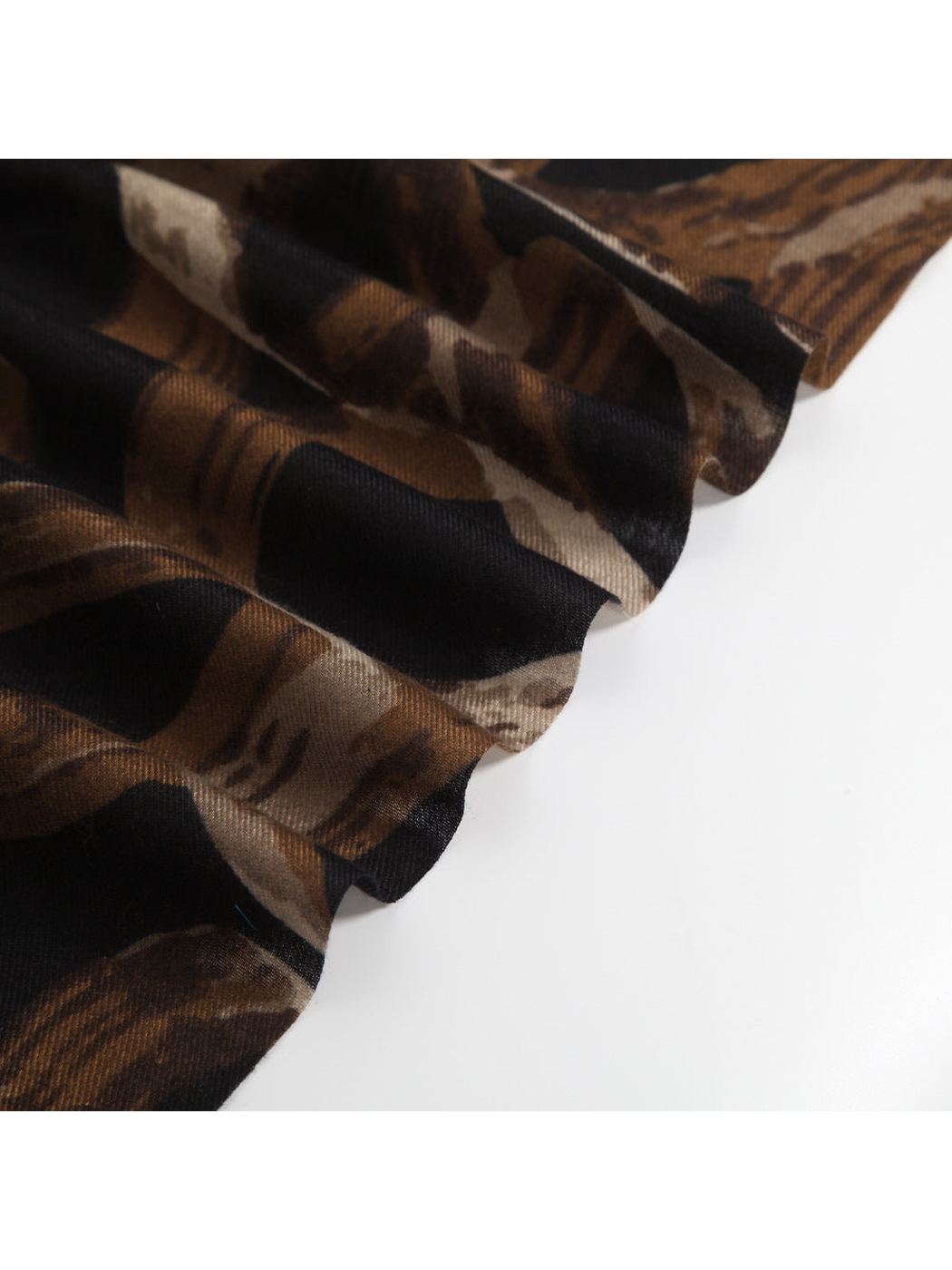 Close-up of the brown and black abstract pattern and fine woven-look texture