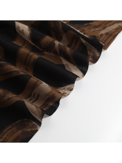Close-up of the brown and black abstract pattern and fine woven-look texture