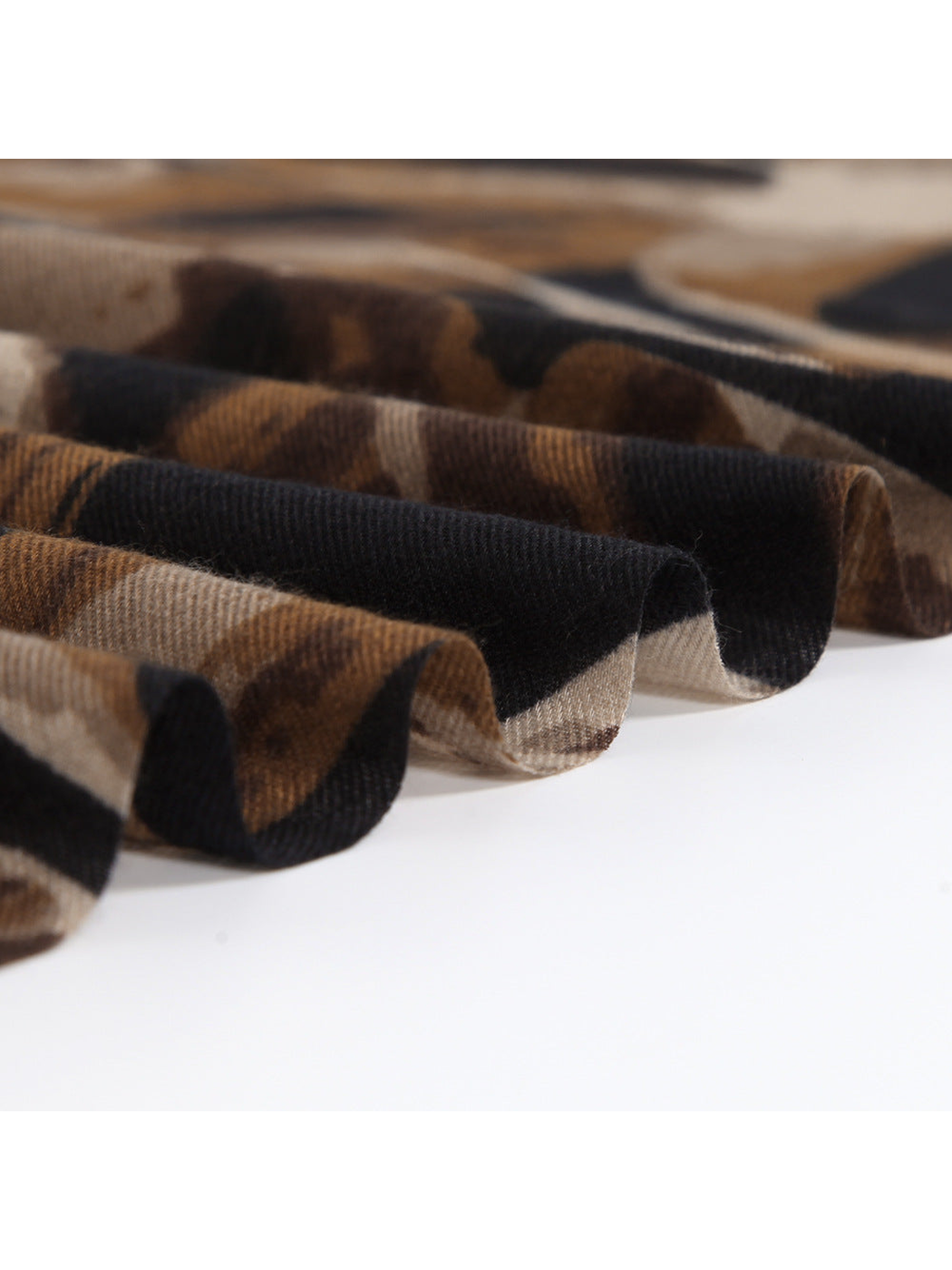 Close-up of the brown and black scarf arranged in soft folds