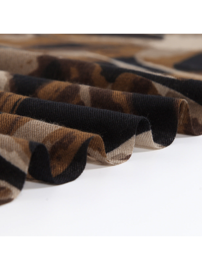 Close-up of the brown and black scarf arranged in soft folds