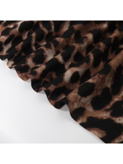 Close-up of the brown abstract leopard-print scarf edge and gathered folds