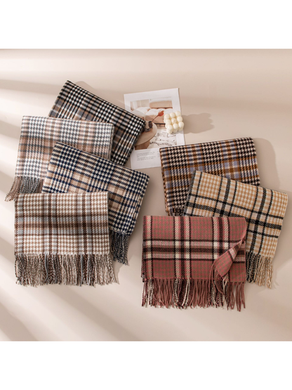 Seven plaid fringed scarf color options arranged in natural light