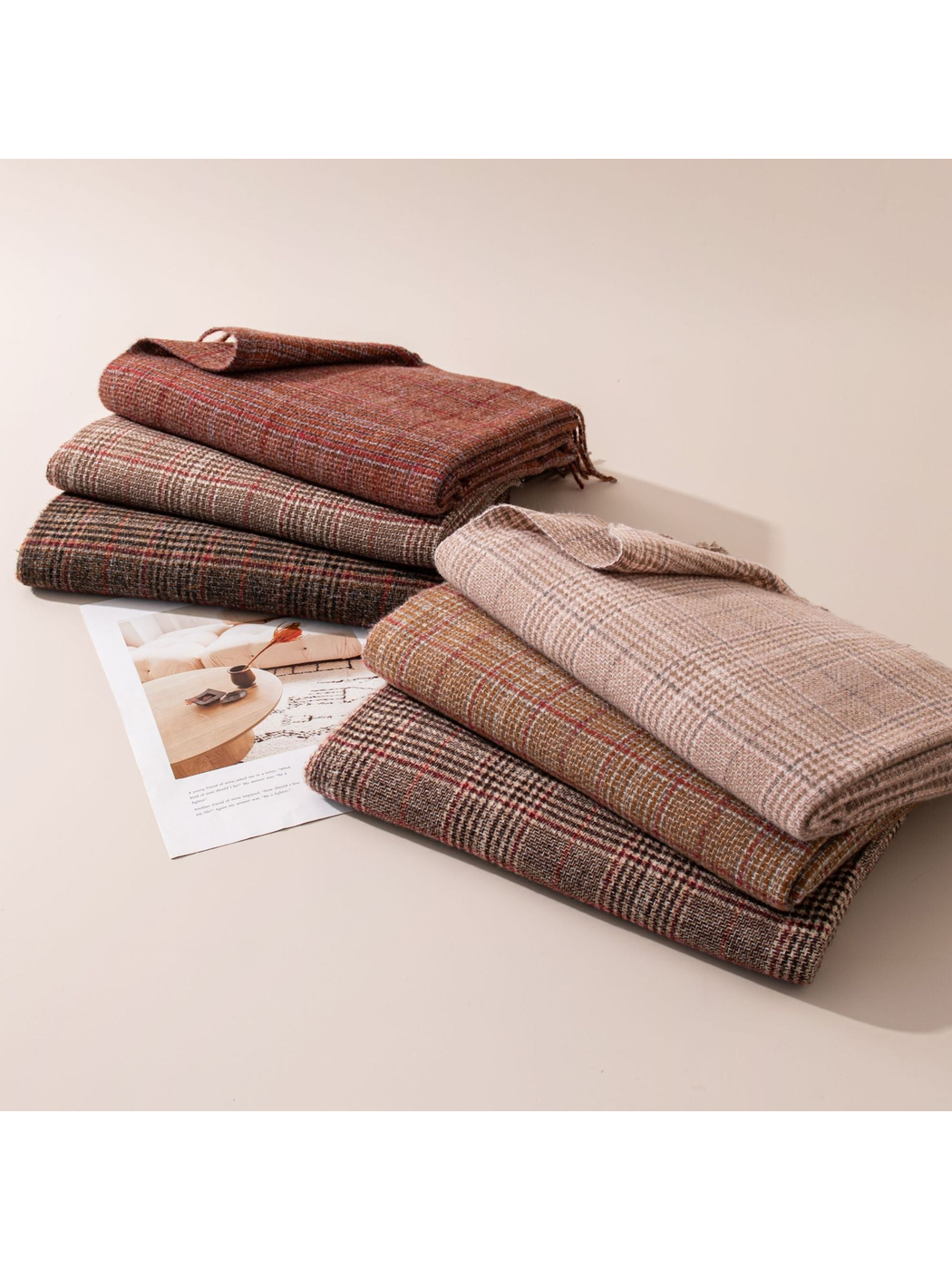 Six plaid scarves folded in two coordinated stacks