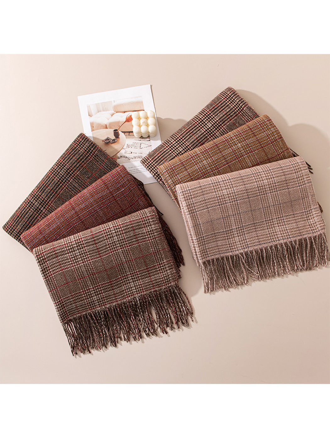 Six plaid fringed scarves arranged in two fan-shaped groups