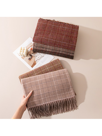 Blush plaid scarf held in front of five folded color options