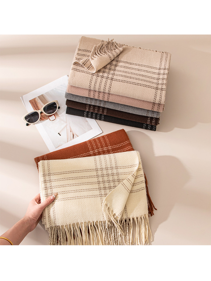 Cream plaid scarf held above a coordinated stack of color options