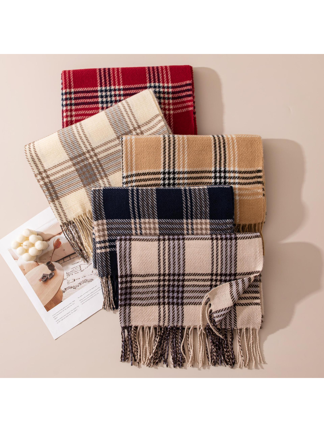 Five plaid scarf colors arranged with fringed edges visible