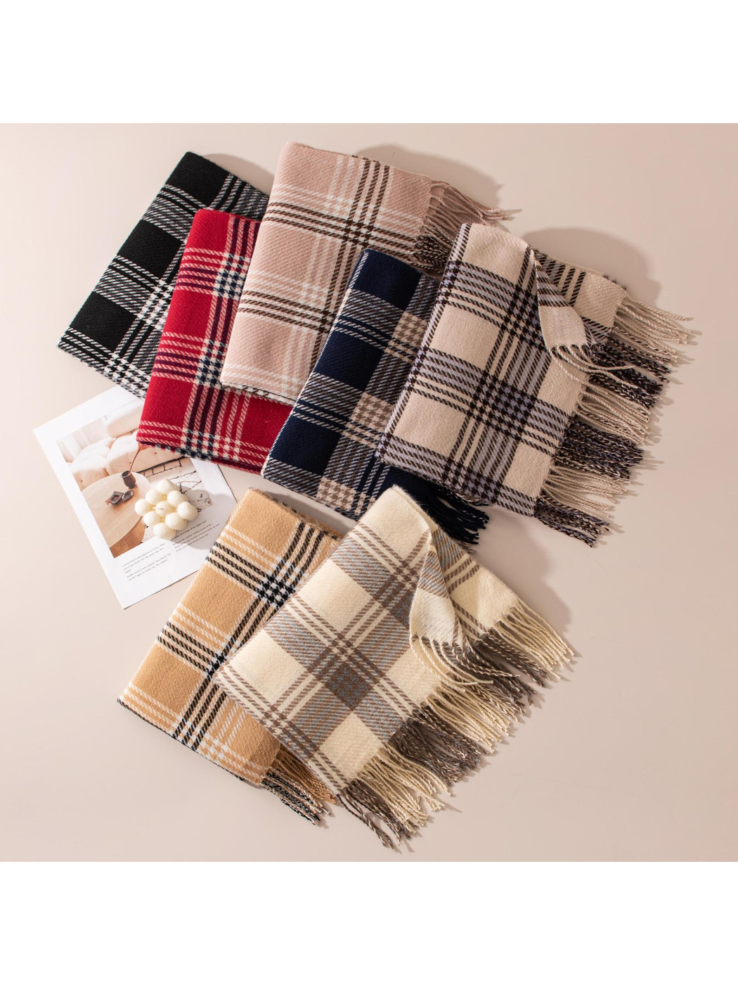 Assorted plaid scarves arranged in overlapping rows