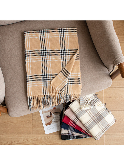 Camel plaid scarf displayed on an armchair beside stacked color options