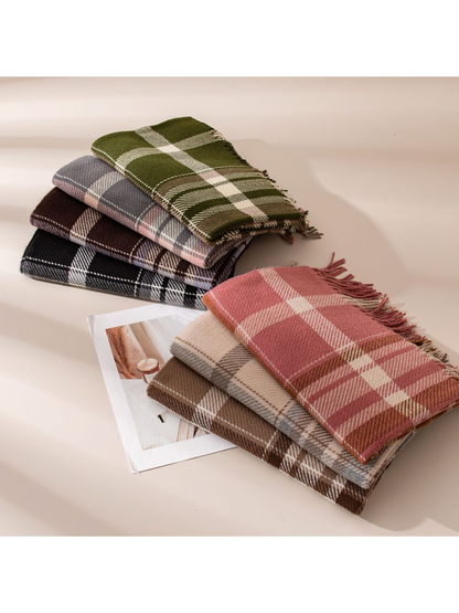 Seven plaid fringe scarf colorways displayed in two folded stacks