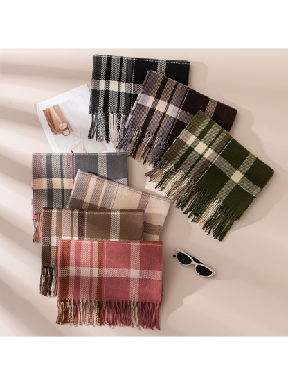 Seven plaid fringe scarf colorways arranged in an overhead display
