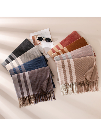 Assorted plaid scarves arranged in two color groups with fringed ends