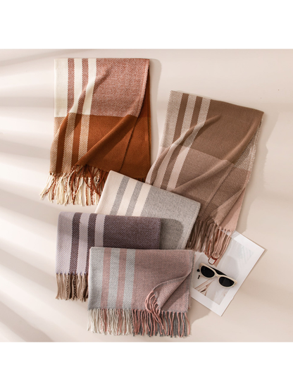 Five plaid scarf colors arranged flat with visible fringe and folded corners