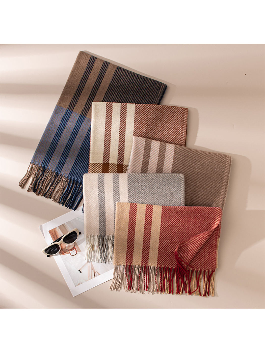 Five plaid scarf colors arranged diagonally with fringed ends