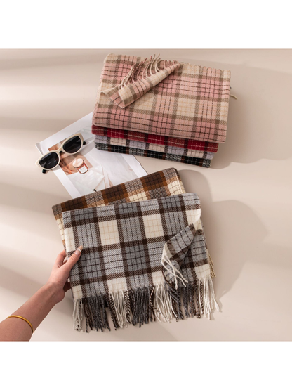 Gray plaid fringed scarf held in front of five folded color options